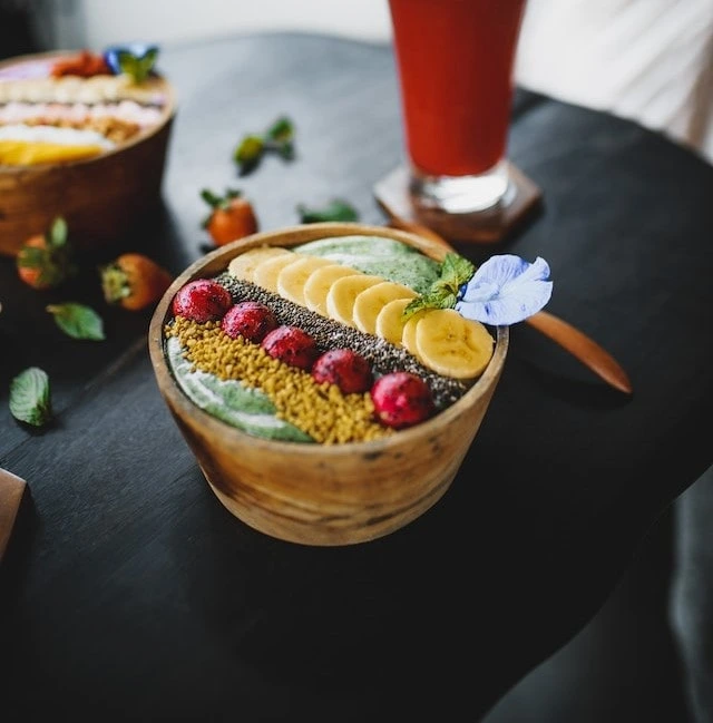 A healthy breakfast bowl of fruits, seeds and yoghurt