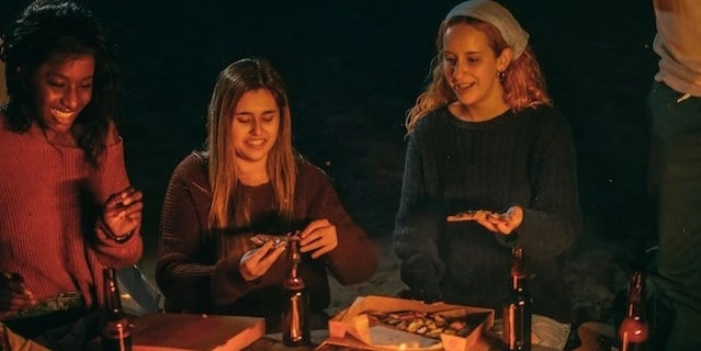 Small group eating pizza and having fun