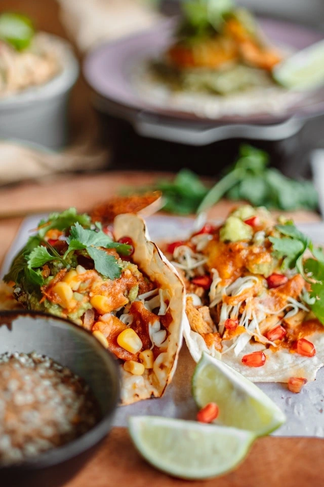 Close-up of tacos, lime and dip