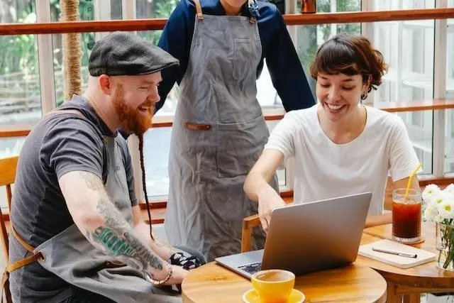 people working in a cafe